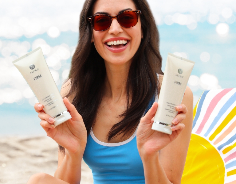 Woman smiling and holding Neora’s best-selling Firm Body Contour Cream 2-Pack—save up to $40 this month only.